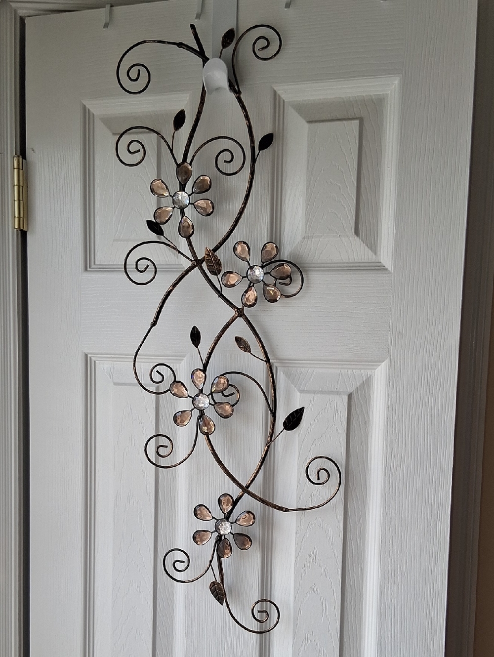 Metal Floral Scroll Wall Hanging in Bronze